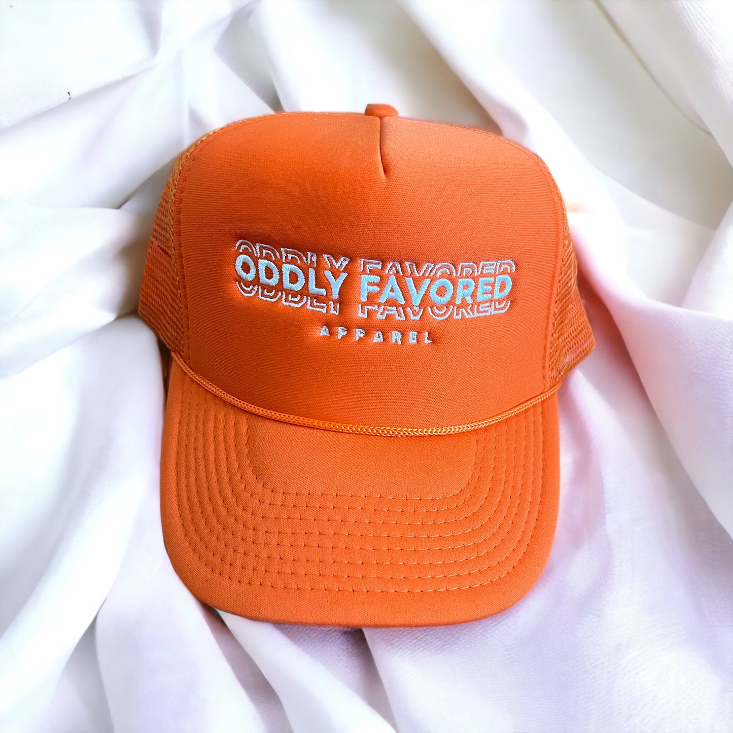 Embroidered Oddly Favored Logo Trucker Hat