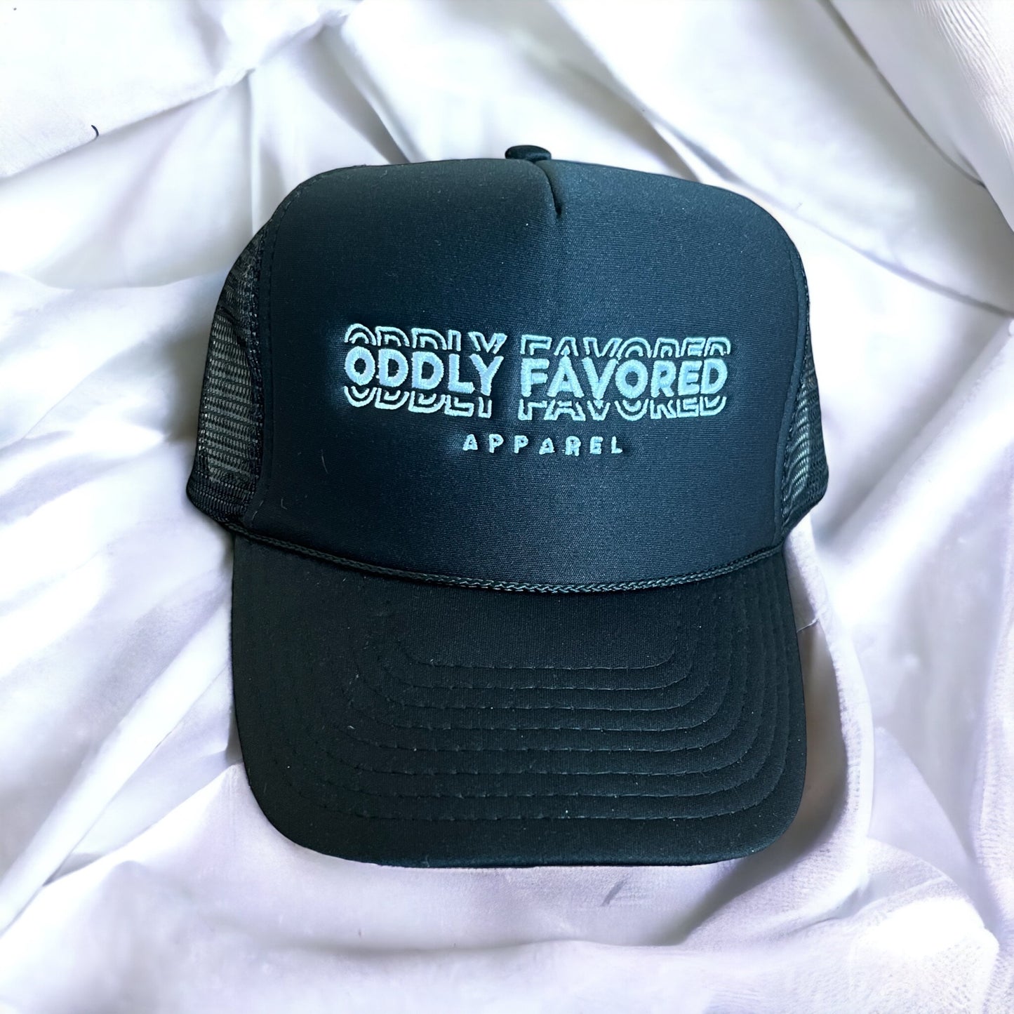 Embroidered Oddly Favored Logo Trucker Hat